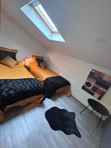 Postel nebo postele na pokoji v ubytování Loft serenity du condroz