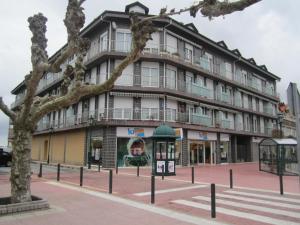 a building on the corner of a street at CASA MANUELA in Suances
