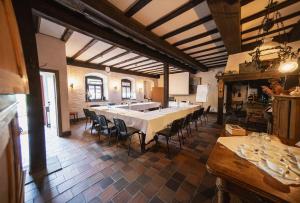 a large dining room with a long table and chairs at Landgasthof Zum Weissen Schwanen in Braubach