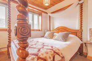 Postel nebo postele na pokoji v ubytování Millrace Cottage