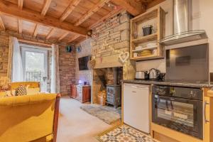 Kuchyň nebo kuchyňský kout v ubytování Millrace Cottage + 18 fotografií