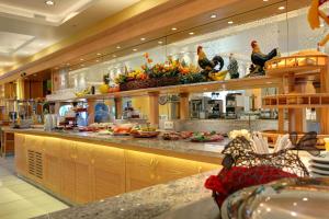 a kitchen with a counter with food on it at Hotel Mühlenthal GmbH in Schwalbach
