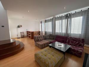 a living room with a couch and a coffee table at Gomera Isla Mágica in San Sebastián de la Gomera
