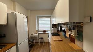 Kuchyň nebo kuchyňský kout v ubytování Japandi apartamentai