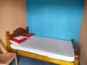 Postel nebo postele na pokoji v ubytování Pushpa Mahal A/C & Pushpa Residency