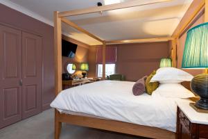 Postel nebo postele na pokoji v ubytování East Beach Guest House