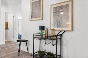 a room with a table and a stool and a picture at Starlight Horizon Cabins A & B - Side-by-Side Group Retreat - Pet-Friendly Texas Hill Country Cabins Near Canyon Lake - Pool, Stargazing, Sleeps 16 in Canyon Lake