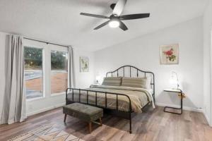 a bedroom with a bed and a ceiling fan at Starlight Horizon Cabins A & B - Side-by-Side Group Retreat - Pet-Friendly Texas Hill Country Cabins Near Canyon Lake - Pool, Stargazing, Sleeps 16 in Canyon Lake +38 photos