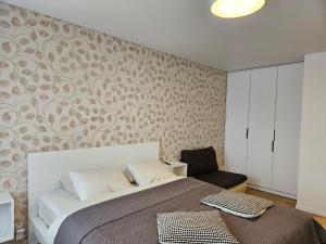 Postel nebo postele na pokoji v ubytování Buto nuoma Žemaitės gatvėje