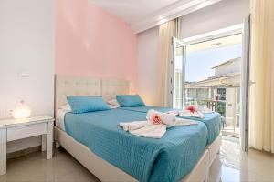 Voodi või voodid majutusasutuse Palotel Design Gouvia toas