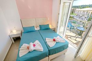 Voodi või voodid majutusasutuse Palotel Design Gouvia toas