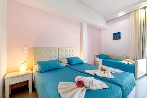 Voodi või voodid majutusasutuse Palotel Design Gouvia toas