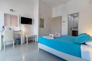 Voodi või voodid majutusasutuse Palotel Design Gouvia toas