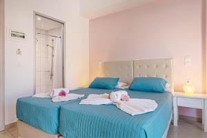 Voodi või voodid majutusasutuse Palotel Design Gouvia toas