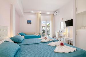Voodi või voodid majutusasutuse Palotel Design Gouvia toas