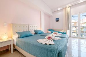 Voodi või voodid majutusasutuse Palotel Design Gouvia toas