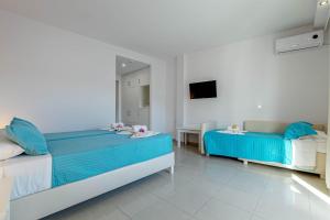Voodi või voodid majutusasutuse Palotel Design Gouvia toas