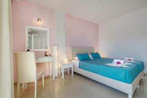 Voodi või voodid majutusasutuse Palotel Design Gouvia toas