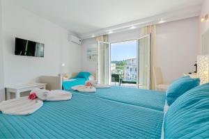 Voodi või voodid majutusasutuse Palotel Design Gouvia toas