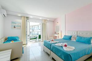Voodi või voodid majutusasutuse Palotel Design Gouvia toas
