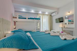 Voodi või voodid majutusasutuse Palotel Design Gouvia toas