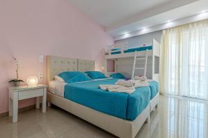Voodi või voodid majutusasutuse Palotel Design Gouvia toas