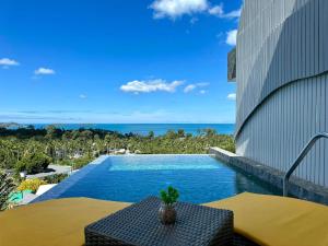 a view of a swimming pool from a building at The Blue Lion Villa koh Samui - Sea view in Chaweng Noi Beach