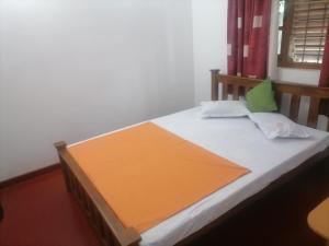 Postel nebo postele na pokoji v ubytování Sunshine Guest House