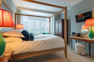 Postel nebo postele na pokoji v ubytování East Beach Guest House