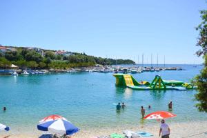 a group of people in the water at a beach at Apartment in Pula/Istrien 17325 in Vintijan