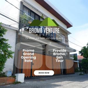 a building with signs on the front of it at Bromo Venture in Probolinggo