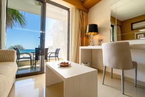 a living room with a view of the ocean at Kamari Beach in Lardos