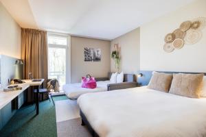 Postel nebo postele na pokoji v ubytování Green Park Hotel Brugge