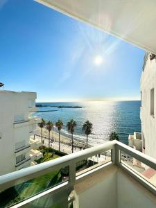 a balcony with a view of the beach and the ocean at SEA VIEW & BEACH ACCESS - Center - Parking in Marbella