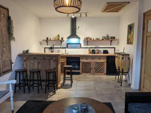 a kitchen with a large island with bar stools at zum runden Turm in Andernach