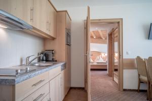 a kitchen with a sink and a counter top at Alpenresidenz am Mühlbach in Obergurgl