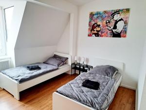 En eller flere senge i et værelse på Work & Stay in Wismar