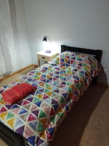 En eller flere senge i et værelse på DUPLEX CENTRICO