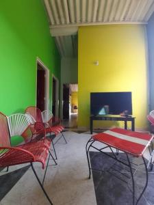 Un televizor și/sau centru de divertisment la Finca El Recuerdo, cerca a Bogota