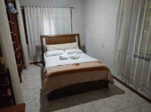 Katil atau katil-katil dalam bilik di Pousada Bonamigos