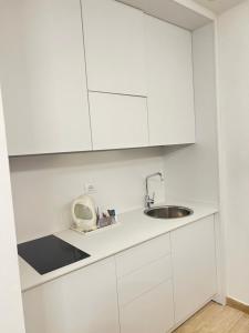 Eldhús eða eldhúskrókur á Astoria Suite Hotel