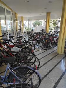 a bunch of bikes parked in a building at Hotel Ginevra in Riccione