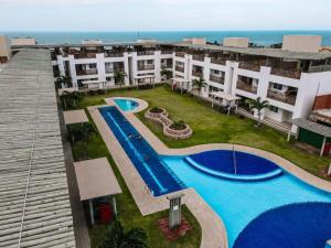 an aerial view of a resort with a swimming pool at Quality - Boas Vistas in Canoa Quebrada