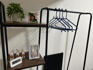 a shelf with a clock and a picture on it at Vintage III - Vacation STAY 14774 in Fukuoka