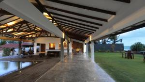 an outdoor patio with a pool and a house at The Beach Boutique in Uswetakeiyawa