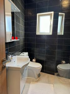Koupelna v ubytování Uniluxury Hotel Prishtina