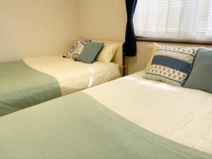Ein Bett oder Betten in einem Zimmer der Unterkunft Star House Miyakojima - Vacation STAY 83169