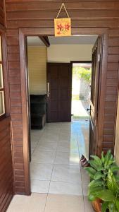 an entrance to a house with a door open at La Casa de Gramado in Gramado