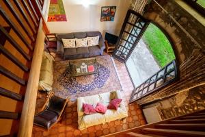 an overhead view of a living room with a couch and chair at The Coach House - Avec piscine partagée in Osserain-Rivareyte