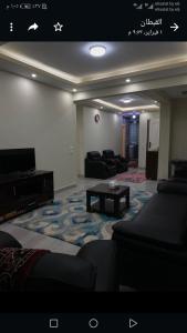 a living room with a couch and a table at المعادى. ميدان الجزائر.رقم 3.شقة 6 in Cairo